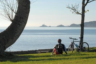 Cyclist overlooking Mumbles.